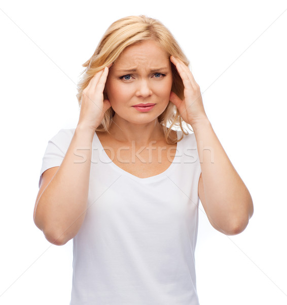 Stock photo: unhappy woman suffering from headache