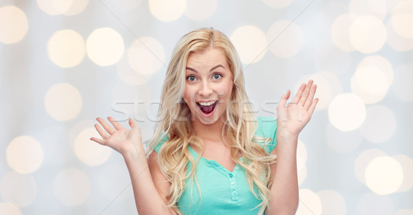 Foto stock: Surpreendido · sorridente · mulher · jovem · emoções · expressões