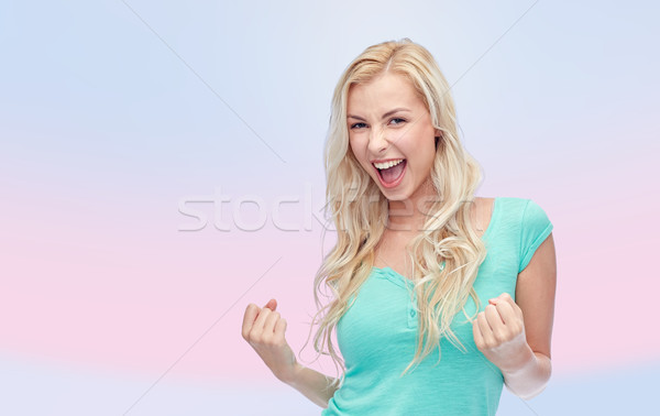 happy young woman or teen girl celebrating victory Stock photo © dolgachov