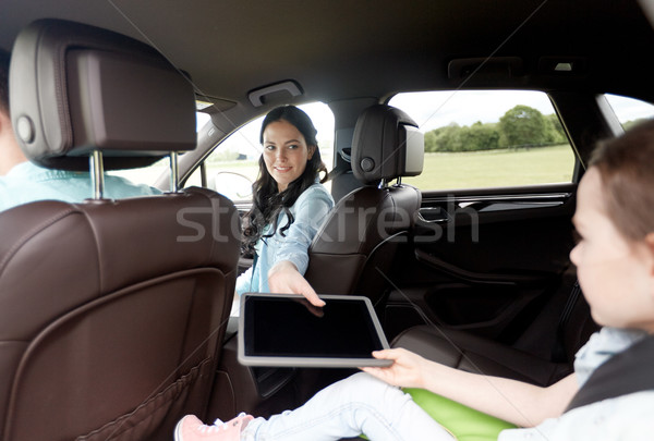 happy family with tablet pc driving in car Stock photo © dolgachov