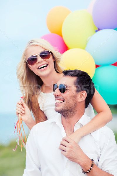 Casal colorido balões beira-mar verão férias Foto stock © dolgachov