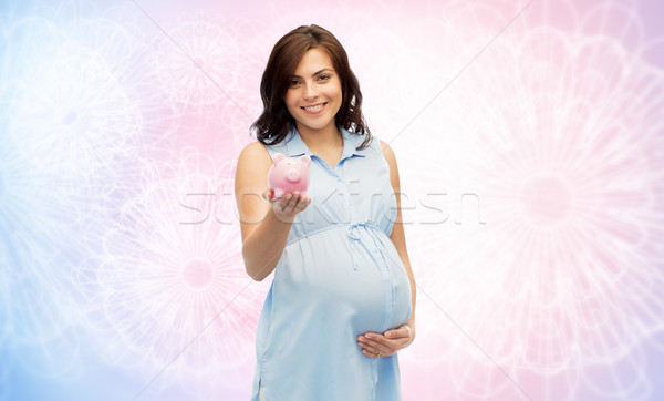 happy pregnant woman with piggybank Stock photo © dolgachov