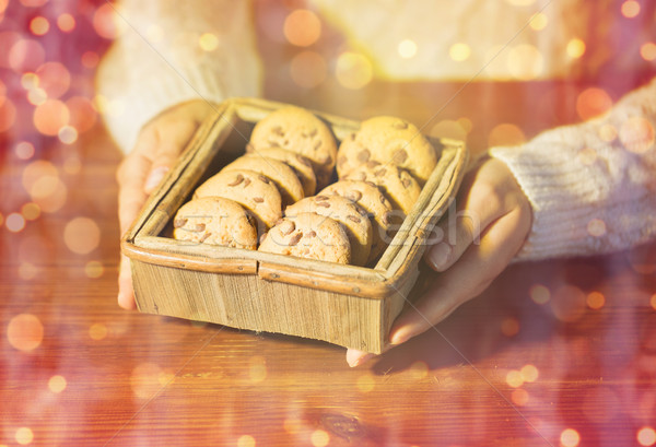 close up of woman with christmas oat cookies Stock photo © dolgachov
