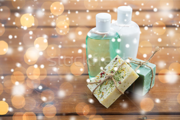 Stock photo: handmade soap bars and lotions on wood