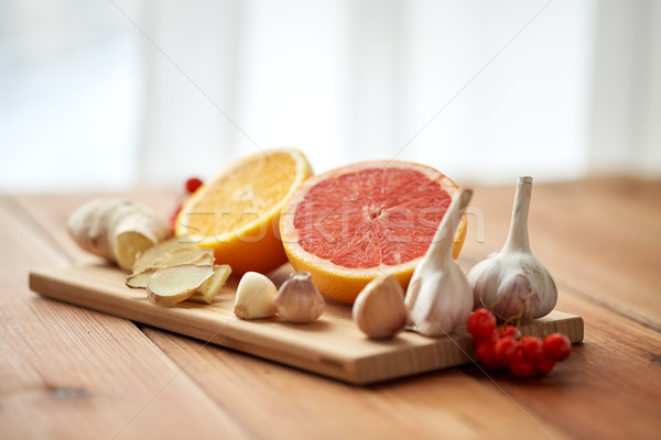 Stock photo: citrus, ginger, garlic and rowanberry on wood