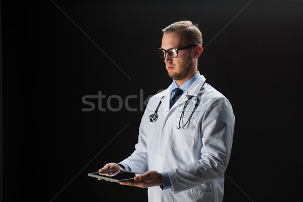 doctor with tablet pc and stethoscope Stock photo © dolgachov