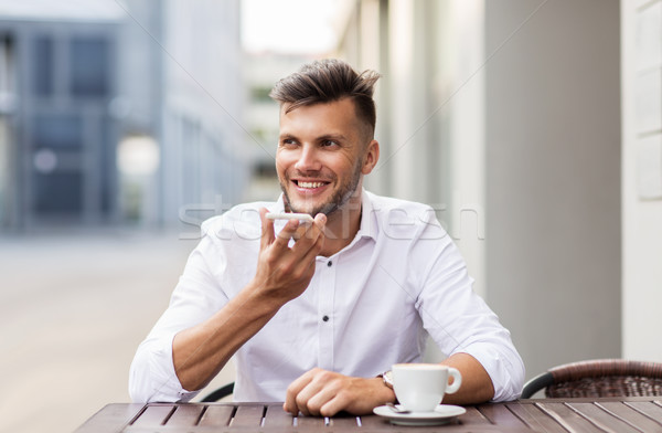 Stock photo: man with coffee and smartphone at city cafe