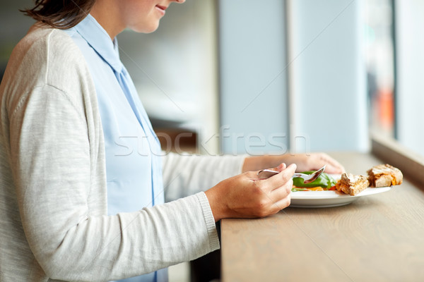 woman eating gazpacho soup at restaurant Stock photo © dolgachov