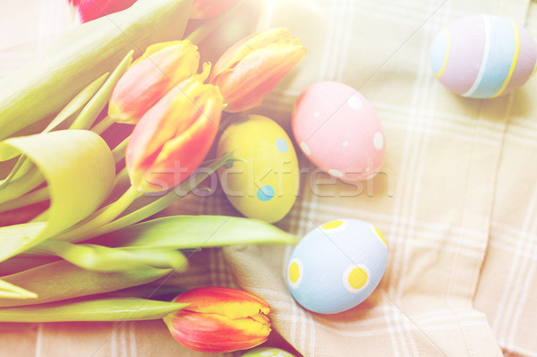 close up of colored easter eggs and flowers Stock photo © dolgachov
