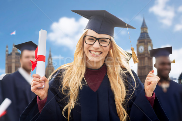 happy student with diploma celebrating graduation Stock photo © dolgachov