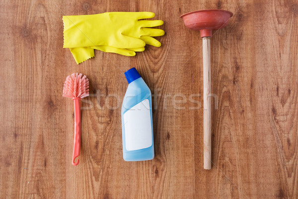 plunger with cleaning stuff on wooden background Stock photo © dolgachov