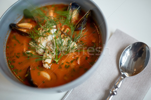 close up of seafood soup with fish and mussels Stock photo © dolgachov
