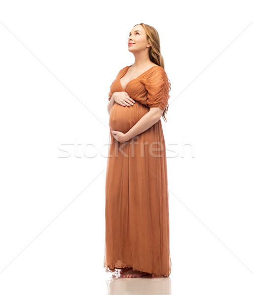 happy pregnant woman touching her big belly Stock photo © dolgachov