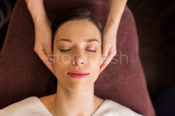 woman having face and head massage at spa Stock photo © dolgachov