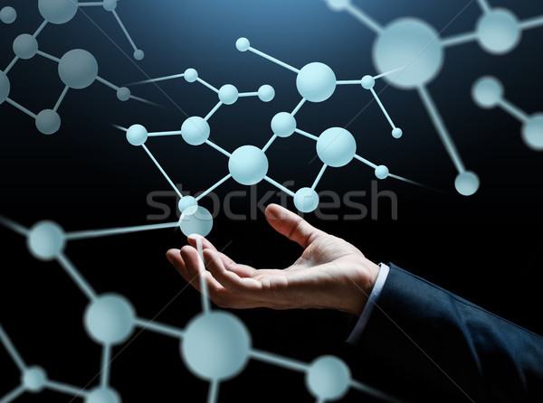 close up of businessman hand with molecule Stock photo © dolgachov