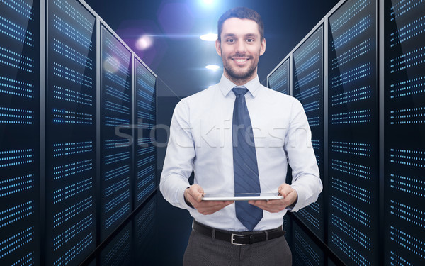 businessman with tablet pc over server room Stock photo © dolgachov