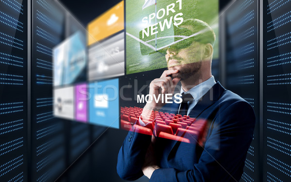 man in virtual reality headset with multimedia Stock photo © dolgachov