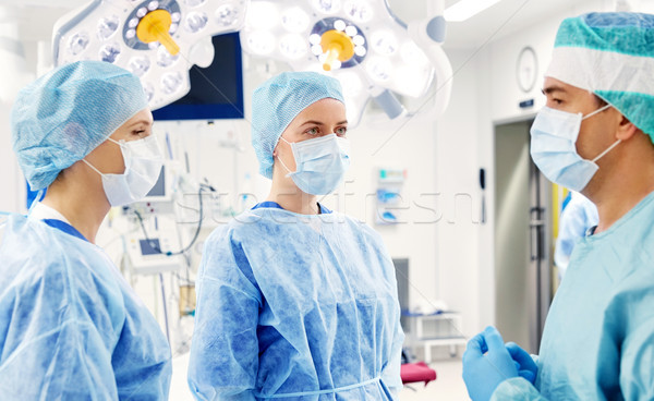 group of surgeons in operating room at hospital Stock photo © dolgachov