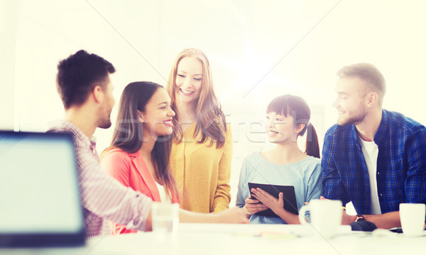 happy creative team or students working at office Stock photo © dolgachov