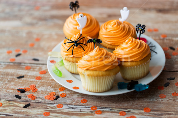 halloween party decorated cupcakes on plate Stock photo © dolgachov