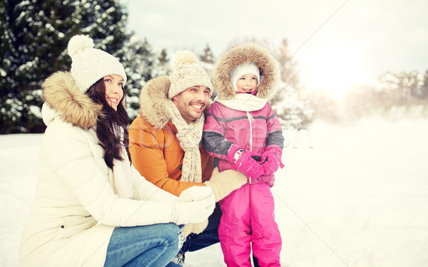 happy family with child in winter clothes outdoors Stock photo © dolgachov