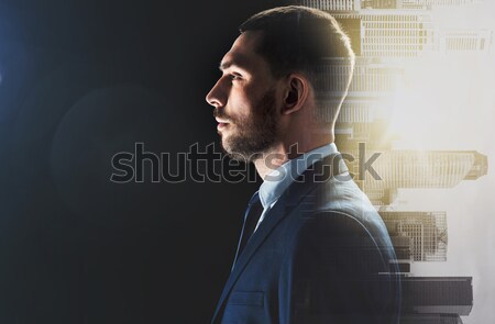 businessman over city buildings Stock photo © dolgachov