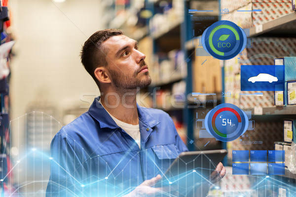 auto mechanic or smith with tablet pc at workshop Stock photo © dolgachov