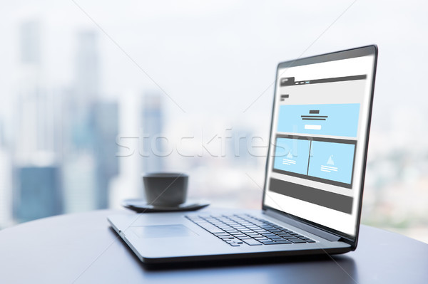 laptop with web page interface design on screen Stock photo © dolgachov