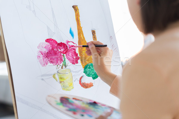 artist with brush painting still life at studio Stock photo © dolgachov