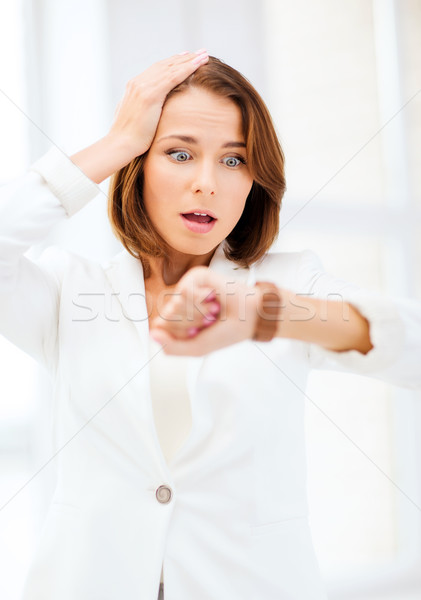 stressed businesswoman looking at clock Stock photo © dolgachov