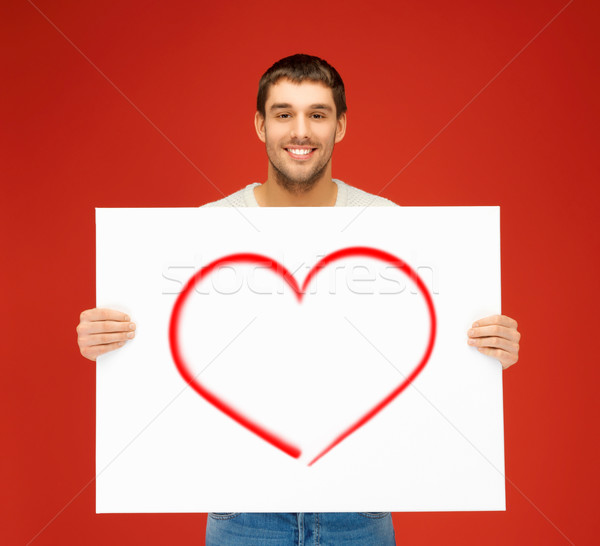 Yakışıklı adam büyük beyaz tahta kalp mutluluk Stok fotoğraf © dolgachov