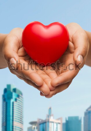 woman and man hands showing heart shape Stock photo © dolgachov