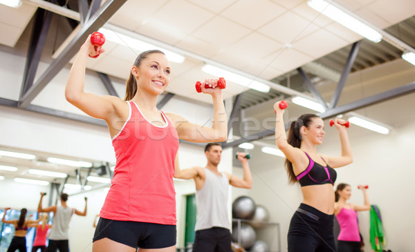 group of people working out with dumbbells Stock photo © dolgachov