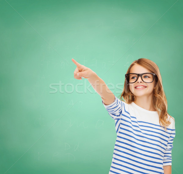 Aranyos kislány szemüveg mutat levegő oktatás Stock fotó © dolgachov