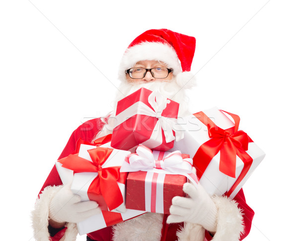 man in costume of santa claus with gift boxes Stock photo © dolgachov