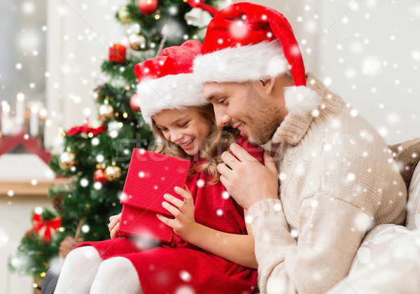 smiling father and daughter holding gift box Stock photo © dolgachov