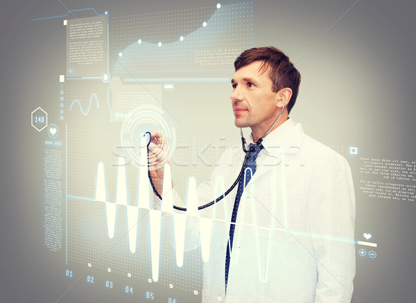 Mężczyzna lekarz stetoskop kardiogram opieki zdrowotnej nowego technologii Zdjęcia stock © dolgachov