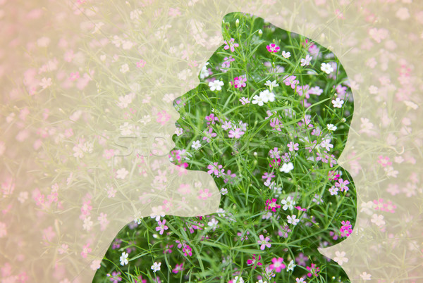 Stock photo: woman silhouette with green floral pattern