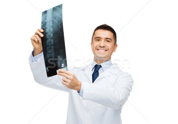 smiling male doctor in white coat holding x-ray Stock photo © dolgachov