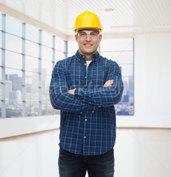 Sonriendo masculina constructor manual trabajador casco Foto stock © dolgachov
