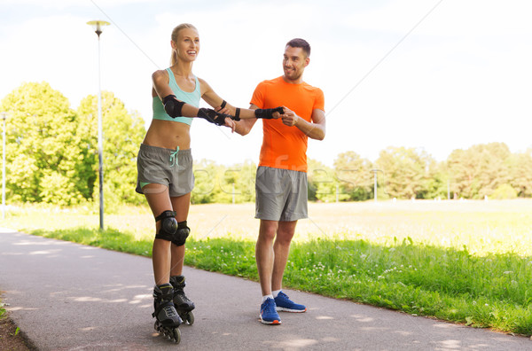 Heureux couple patins équitation extérieur fitness [[stock_photo]] © dolgachov