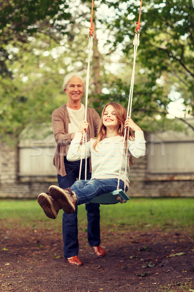 happy family in front of house outdoors Stock photo © dolgachov