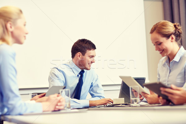 smiling business people with tablet pc in office Stock photo © dolgachov