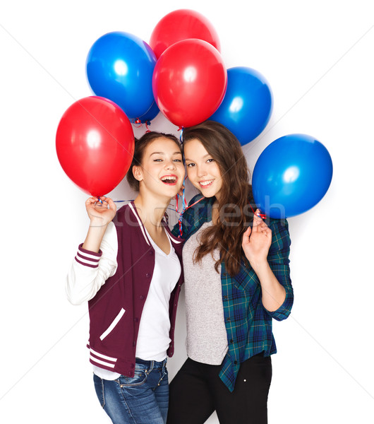 happy teenage girls with helium balloons Stock photo © dolgachov