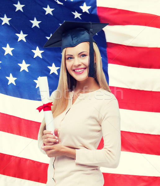 student in graduation cap with certificate Stock photo © dolgachov