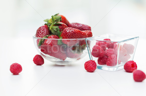 Stock photo: close up of ripe red strawberries and raspberries