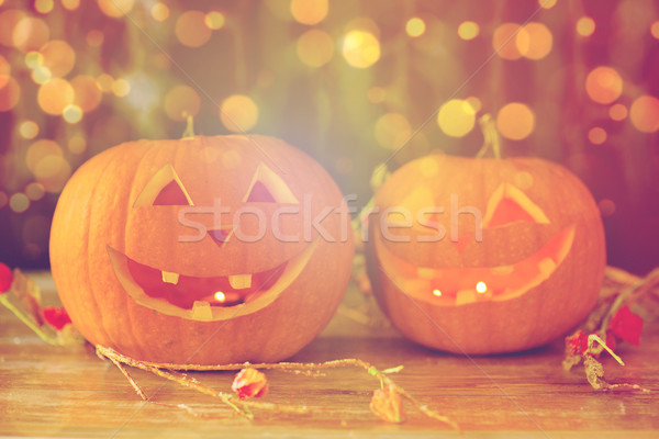 close up of carved halloween pumpkins on table Stock photo © dolgachov
