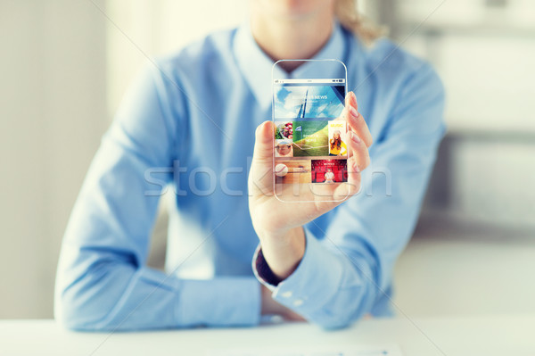 close up of woman with application on smartphone Stock photo © dolgachov