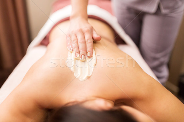 woman having back massage with cream at spa Stock photo © dolgachov