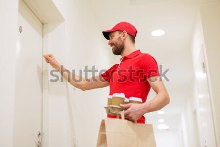 delivery man with pizza boxes knocking on door Stock photo © dolgachov